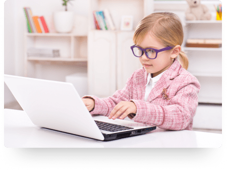 Little girl in a pink jacket and glasses plays pretend secretary with toy computer