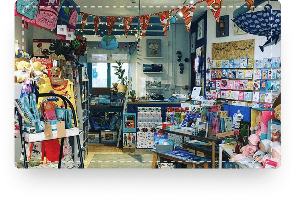 An interior view of the toy shop with colourful shelves of toys, games and books for children